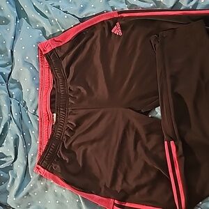 Adidas jersey pants size XL black with mauve accents and zipper at ankles